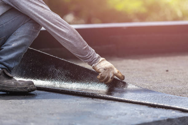 Professional Waterproofing technician working in Packwaukee, WI